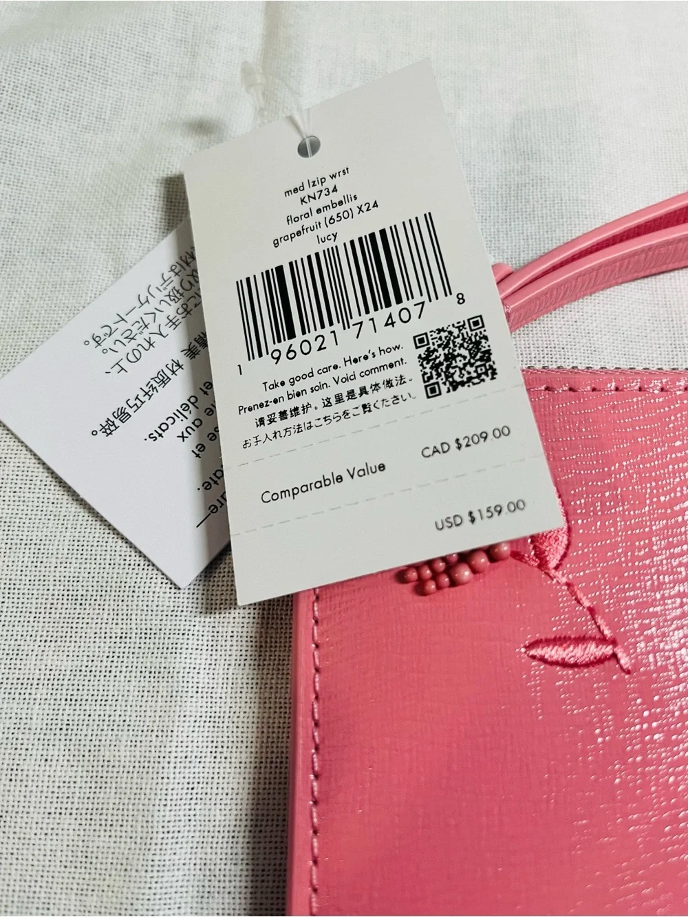 kate spade pink grapefruit soda floral embossed wristlet - NWT